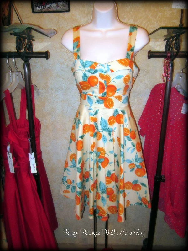 Retro tie-back oranges print hostess dress Must-have floral dresses for this season